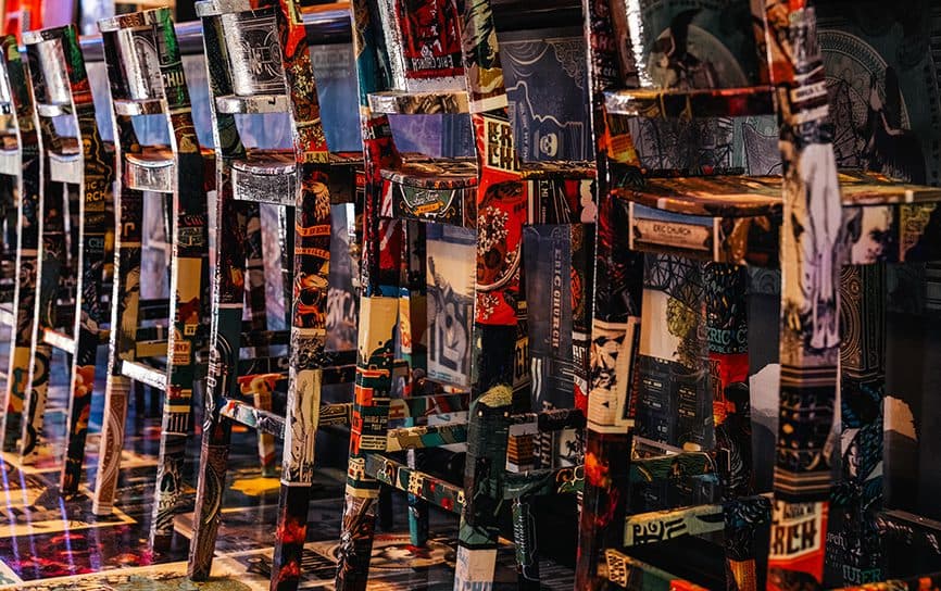 Bar stools covered in posters in Chief's Tavern