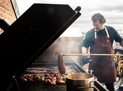 Pit master grilling