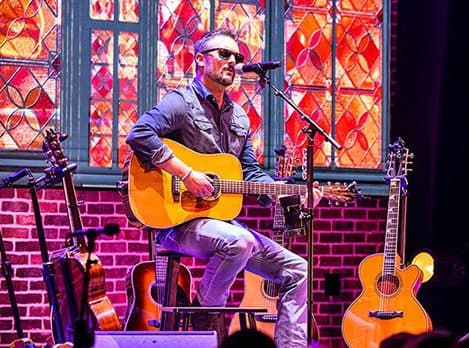 Eric Church on stage in Neon Steeple
