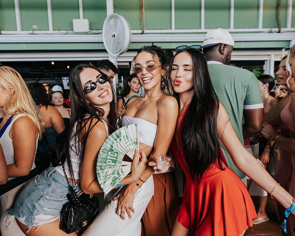 three girls posing for the camera